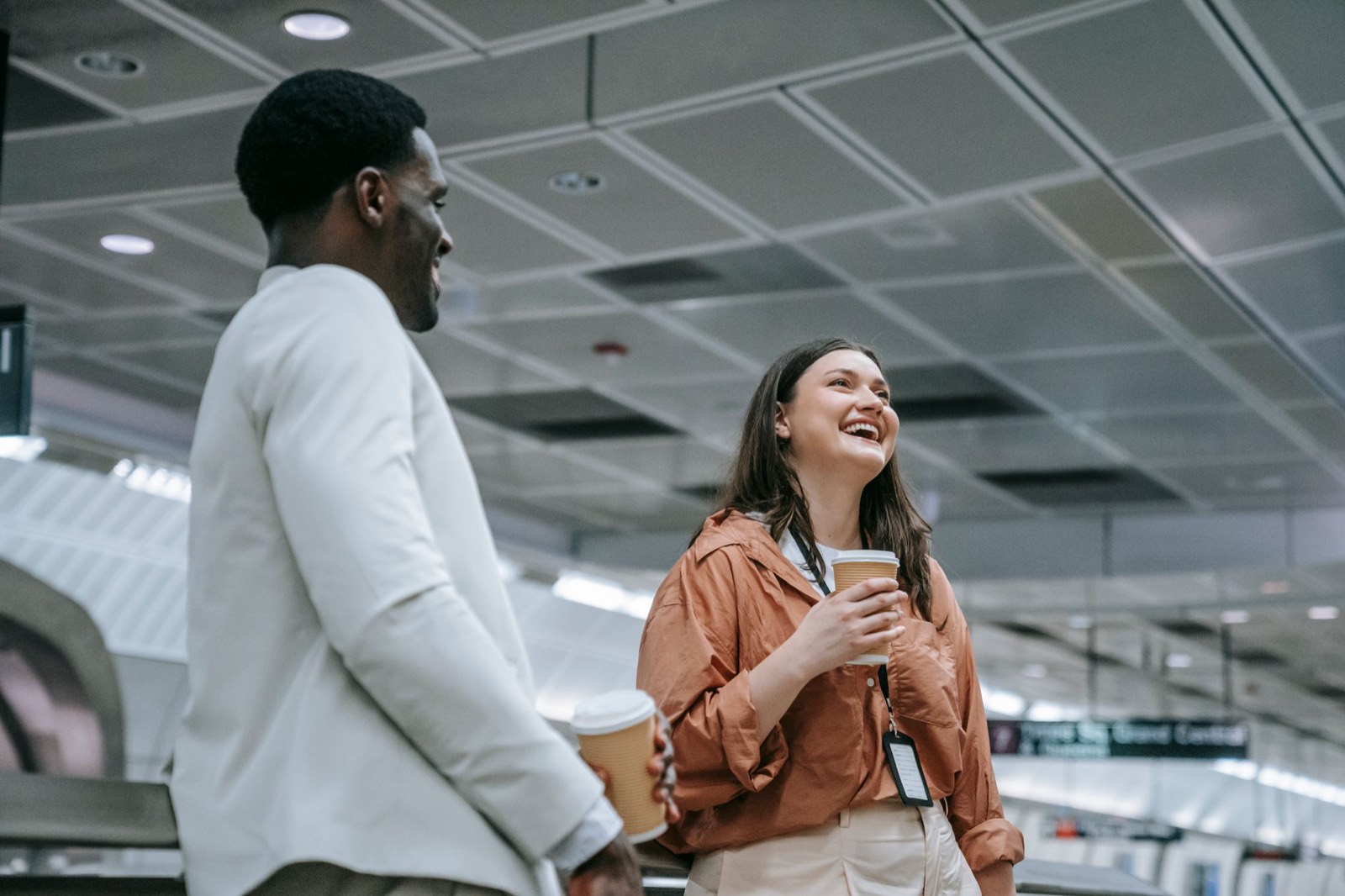 Two people making small talk and smiling during a break